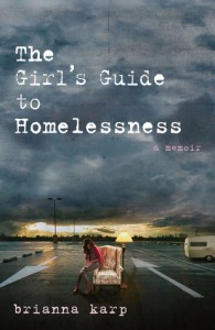 a white woman sits awkwardly on the arm of a chair, which sits next to a lamp in a vacant parking lot as a storm rolls in