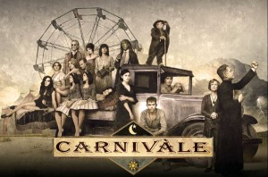 The cast of HBO's show Carnivale sit in costume, dust bowl era fashions and a pickup truck framing a ferris wheel