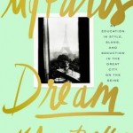 A black and white photo of a paris window view is shown scrapbook style on a sea green cover with the title in boldly gold handwriting